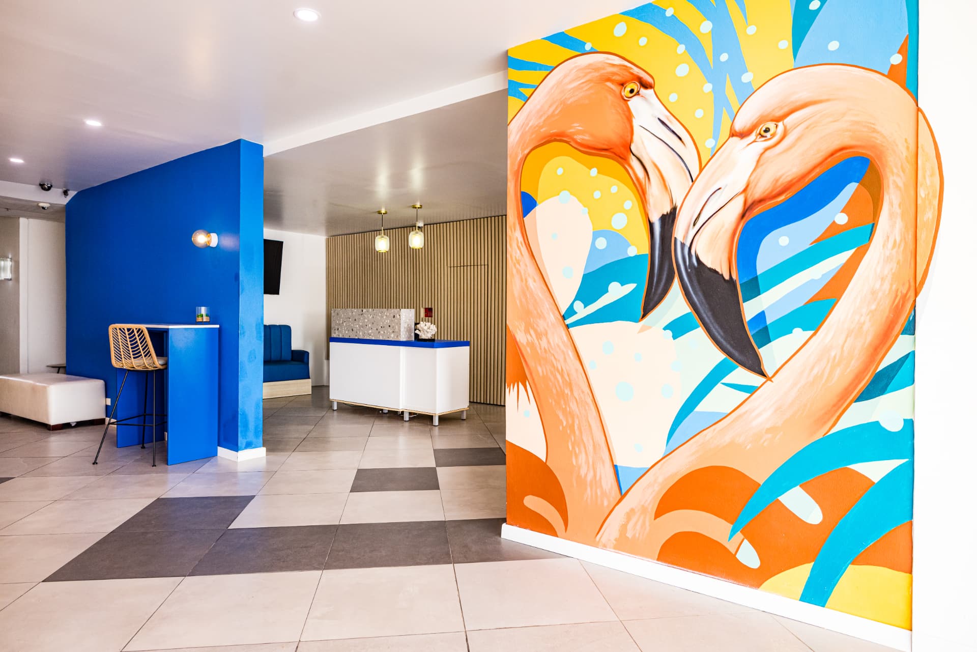 Hotel lobby with a colourful flamingo mural